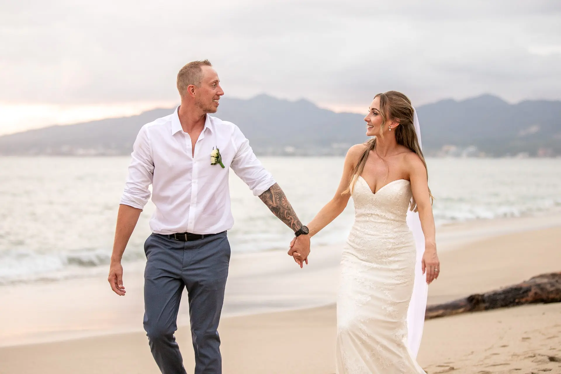 Bride and groom walking on the beach in Puerto Vallarta, Jalisco, Mexico