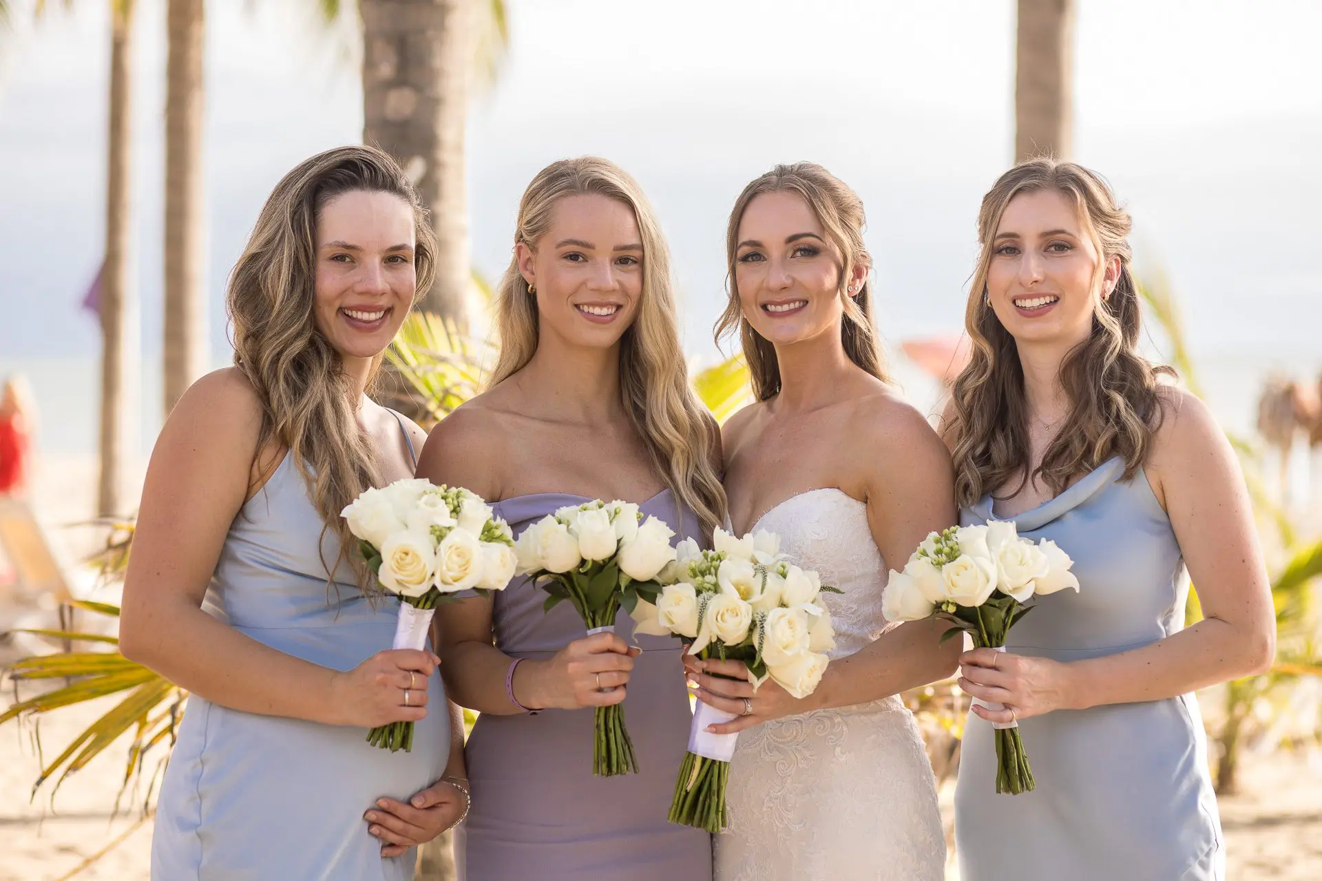 Bridesmaids with the bride on the beach at a destination wedding in Puerto Vallarta, Mexico