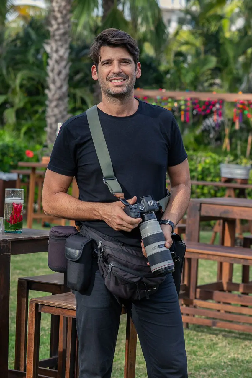 A wedding photographer with a Canon camera during a wedding in Puerto Vallarta, Mexico