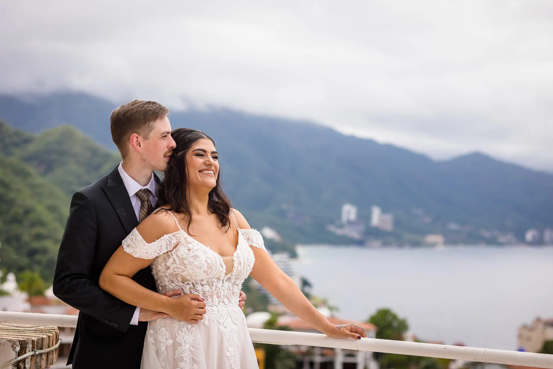 Bride and groom overlooking Banderas Bay at their private villa in Puerto Vallarta, Mexico