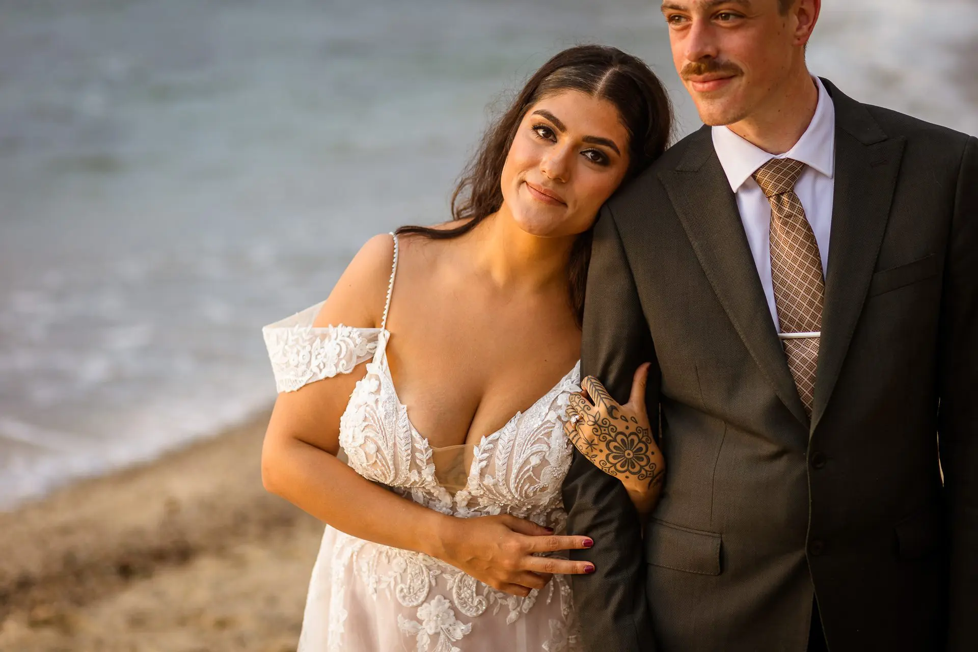 Bride and groom on the beach at their wedding in Cabo San Lucas, Baja California, Mexico