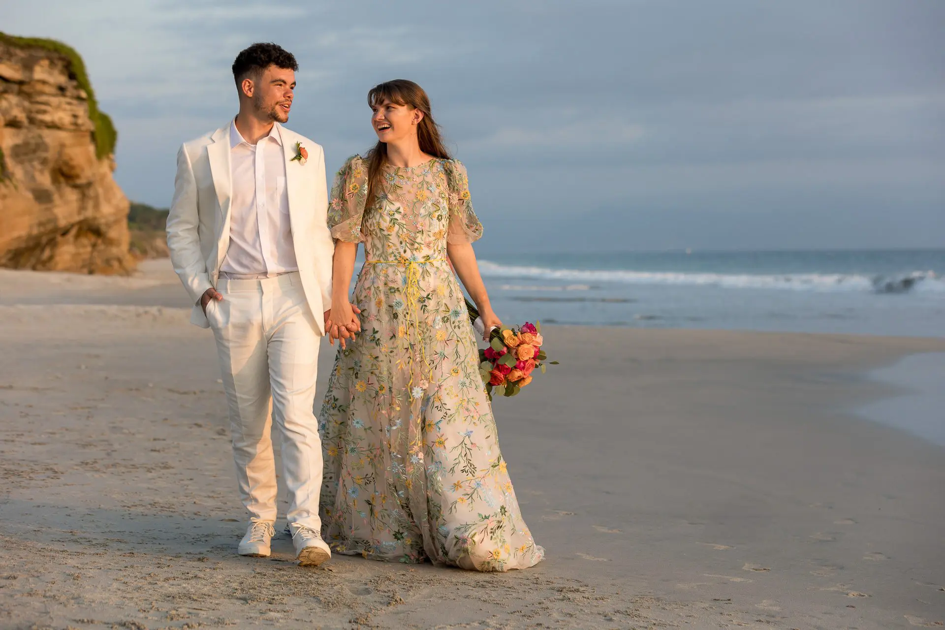 Couple walking along the beach on their wedding day in Puerto Vallarta, Mexico