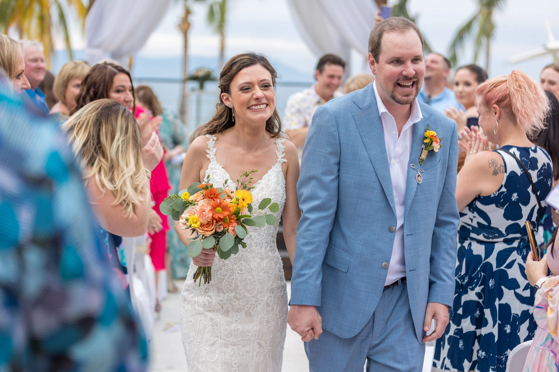 Bride and groom walk down the aisle at their destination wedding in Puerto Vallarta, Mexico